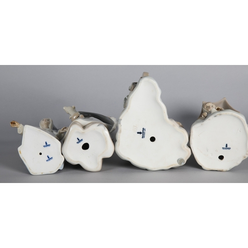 5 - Four Lladro figures to include two girl with lamb figures, 'Fairy Godmother', and 'Girl with geese' ... 