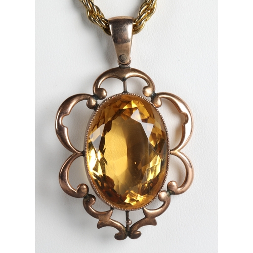 58 - 9ct gold pendant set with a large citrine on yellow metal chain.