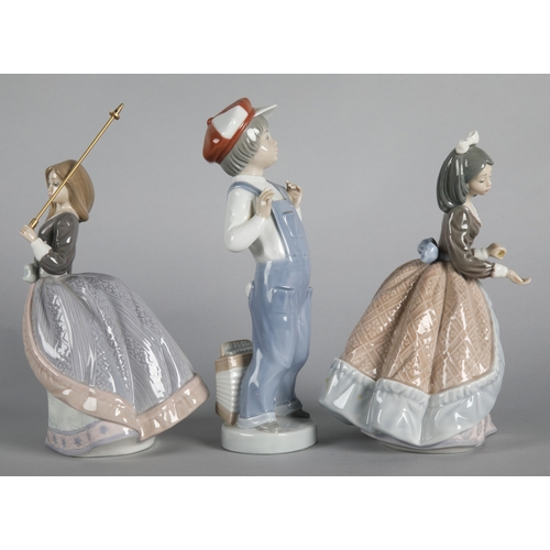 7 - Three Lladro figures to include 'Boy from Madrid with Accordian' 4898, 'Jolie' 5210, and 'Angela' 52... 