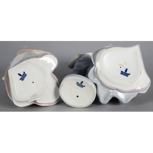 7 - Three Lladro figures to include 'Boy from Madrid with Accordian' 4898, 'Jolie' 5210, and 'Angela' 52... 