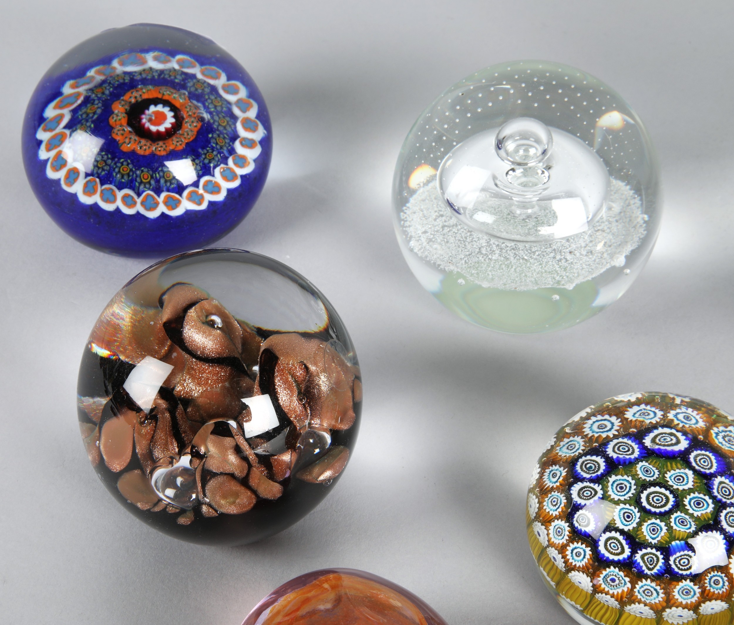 Collection of ten glass paperweight to include Caithness etc.