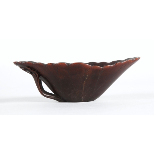 175 - 18th century Rhinoceros horn libation cup in the form of a lotus leaf. The cup has been split and re... 