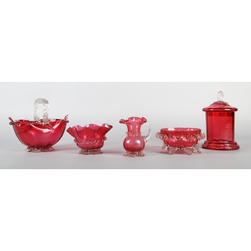 27 - Collection of cranberry glass to include bowls and jug with fluted edges, basket, and a lidded jar (... 