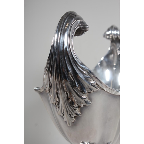 1 - Edwardian silver centrepiece with boat shaped bowl having acanthus leaf scroll handles and raised on... 