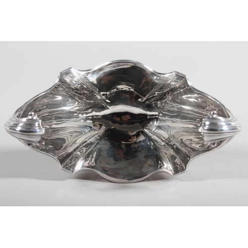 1 - Edwardian silver centrepiece with boat shaped bowl having acanthus leaf scroll handles and raised on... 