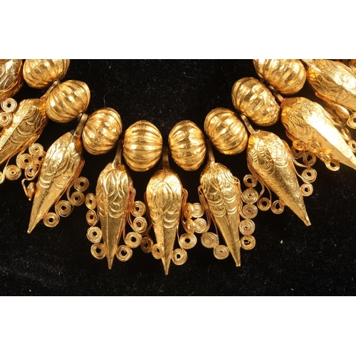 148 - Eastern high carat gold fringe collar formed of alternating pumpkin shaped and faceted cone drops wi... 