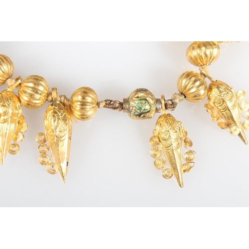 148 - Eastern high carat gold fringe collar formed of alternating pumpkin shaped and faceted cone drops wi... 