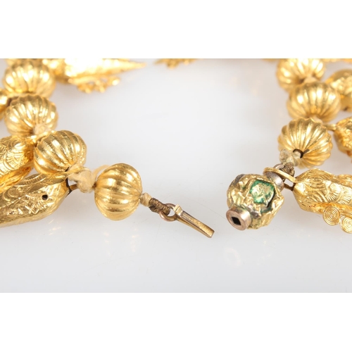 148 - Eastern high carat gold fringe collar formed of alternating pumpkin shaped and faceted cone drops wi... 