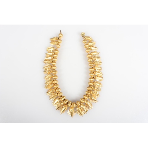 148 - Eastern high carat gold fringe collar formed of alternating pumpkin shaped and faceted cone drops wi... 