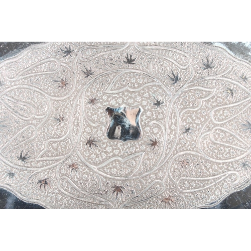 4 - Indian white metal twin handled tray with all over engraved floral decoration, 51cm long, 1061g.