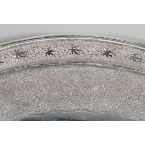 4 - Indian white metal twin handled tray with all over engraved floral decoration, 51cm long, 1061g.