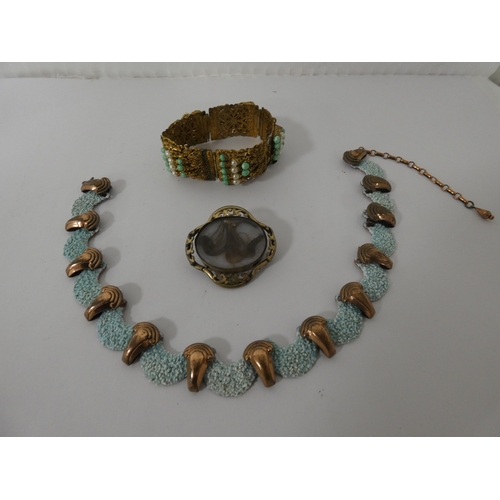 Victorian-style scroll mourning brooch containing a lock of hair ...