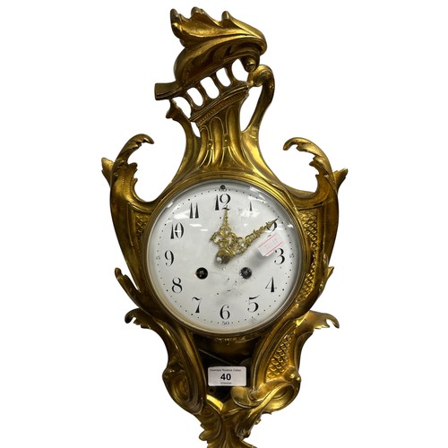 40 - French gilt metal scroll wall clock, the works by F Marti of Paris, striking on a bell.