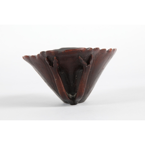 175 - 18th century Rhinoceros horn libation cup in the form of a lotus leaf. The cup has been split and re... 