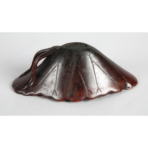 175 - 18th century Rhinoceros horn libation cup in the form of a lotus leaf. The cup has been split and re... 