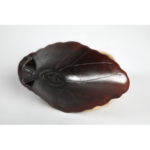 175 - 18th century Rhinoceros horn libation cup in the form of a lotus leaf. The cup has been split and re... 