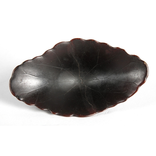 175 - 18th century Rhinoceros horn libation cup in the form of a lotus leaf. The cup has been split and re... 