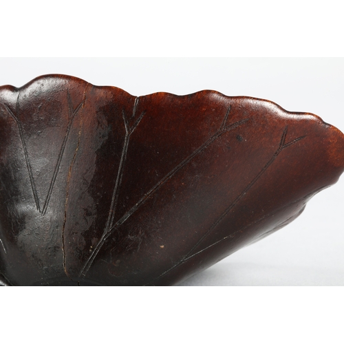 175 - 18th century Rhinoceros horn libation cup in the form of a lotus leaf. The cup has been split and re... 
