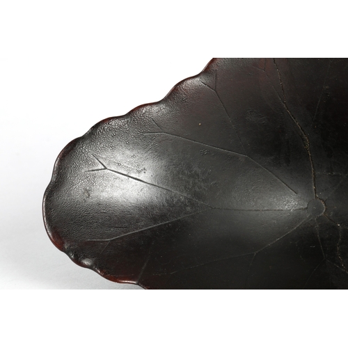 175 - 18th century Rhinoceros horn libation cup in the form of a lotus leaf. The cup has been split and re... 