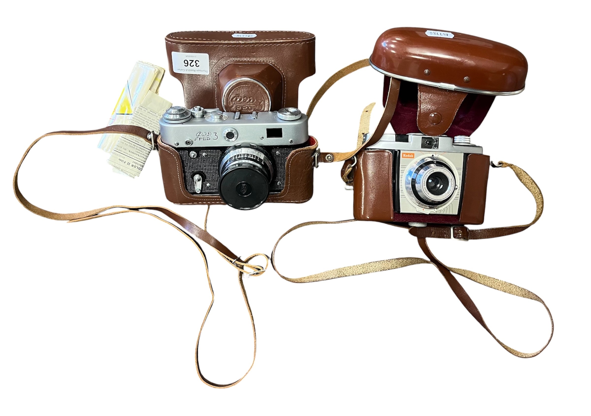 Two cased vintage film cameras to include Kodak and another.