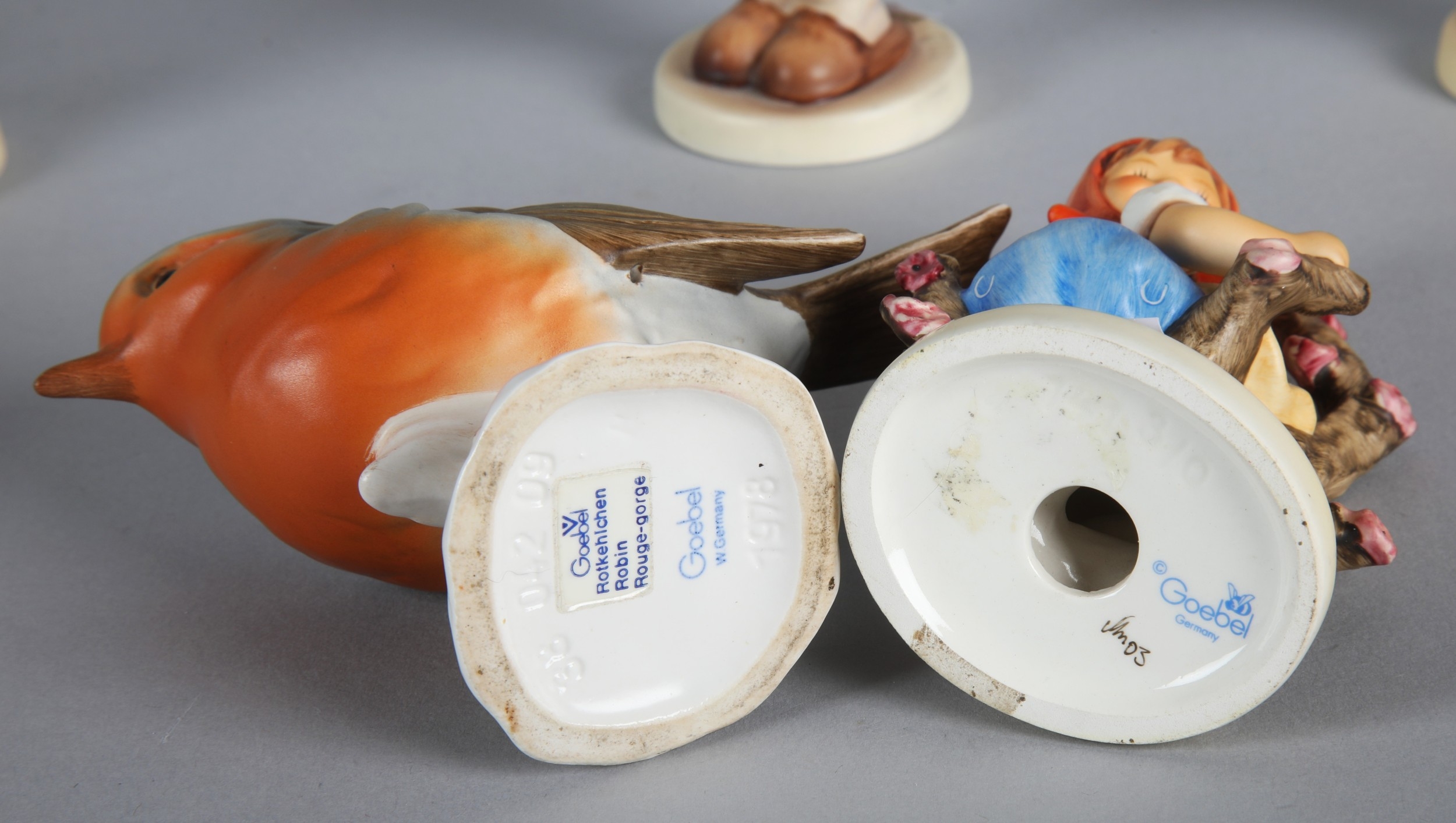 Collection of Goebel Hummel pin dishes and display rack with ten Hummel ...