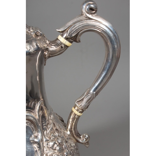 82 - Victorian silver four piece tea service having all over repousse floral, Rococo scroll and green man... 