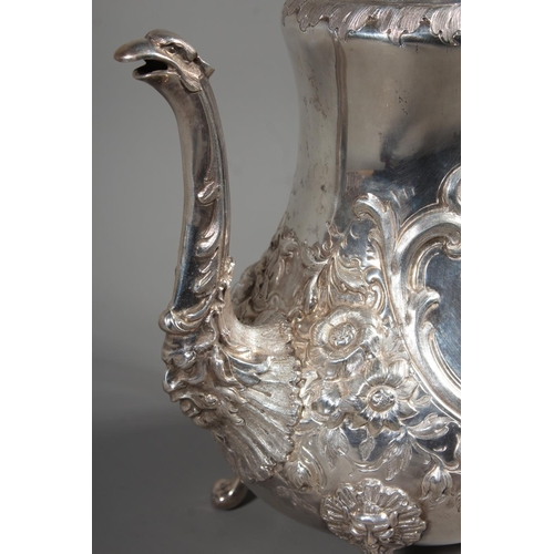 82 - Victorian silver four piece tea service having all over repousse floral, Rococo scroll and green man... 