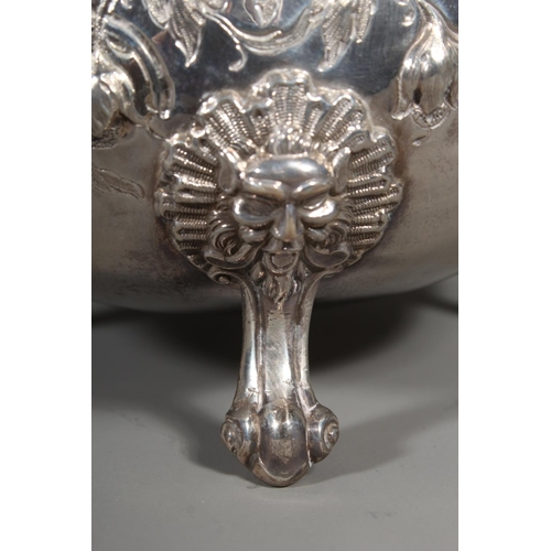 82 - Victorian silver four piece tea service having all over repousse floral, Rococo scroll and green man... 