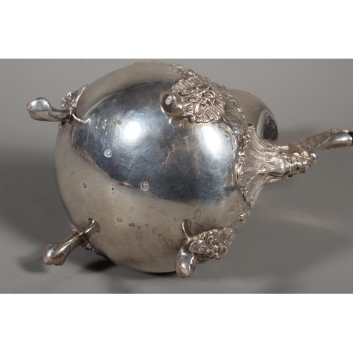 82 - Victorian silver four piece tea service having all over repousse floral, Rococo scroll and green man... 