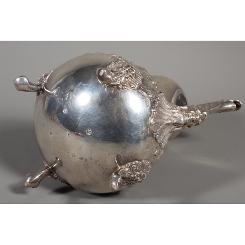 82 - Victorian silver four piece tea service having all over repousse floral, Rococo scroll and green man... 