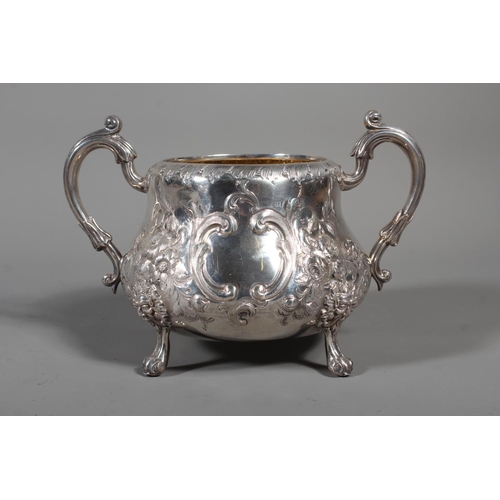 82 - Victorian silver four piece tea service having all over repousse floral, Rococo scroll and green man... 