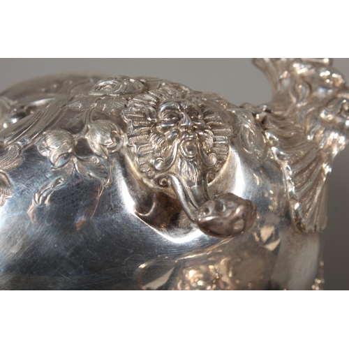 82 - Victorian silver four piece tea service having all over repousse floral, Rococo scroll and green man... 
