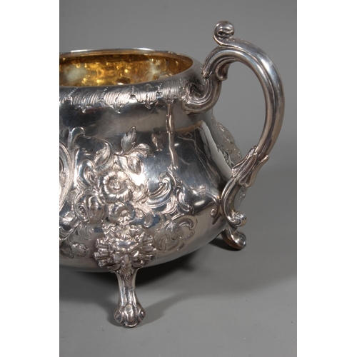 82 - Victorian silver four piece tea service having all over repousse floral, Rococo scroll and green man... 