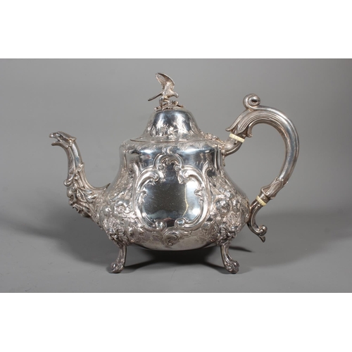82 - Victorian silver four piece tea service having all over repousse floral, Rococo scroll and green man... 