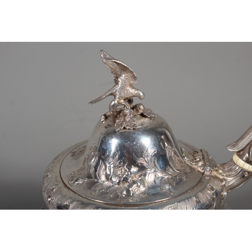 82 - Victorian silver four piece tea service having all over repousse floral, Rococo scroll and green man... 