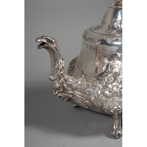 82 - Victorian silver four piece tea service having all over repousse floral, Rococo scroll and green man... 