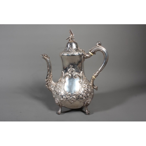 82 - Victorian silver four piece tea service having all over repousse floral, Rococo scroll and green man... 
