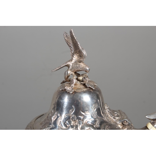 82 - Victorian silver four piece tea service having all over repousse floral, Rococo scroll and green man... 