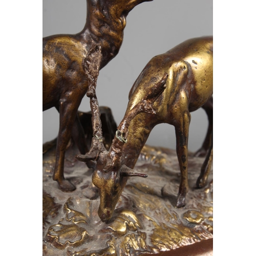 255 - Gilt metal cast figure of two stags and a cold painted bronze of a grouse.&nbsp; (2)