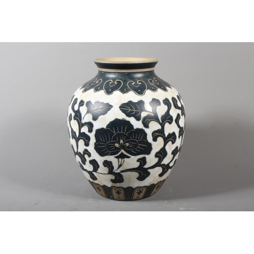 265 - Chinese Cizhou style sgraffito peony vase, 21cm high.