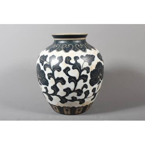 265 - Chinese Cizhou style sgraffito peony vase, 21cm high.