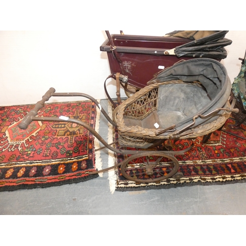 107 - Four dolls prams and a pine dolls cradle with contents.