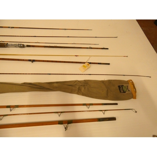 66 - Four assorted vintage split cane fishing rods.