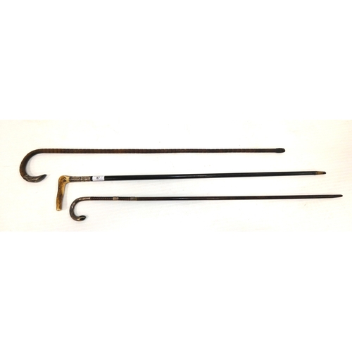 87 - Two Edwardian silver mounted walking sticks, to include an ebonised example with antler grip, and an... 