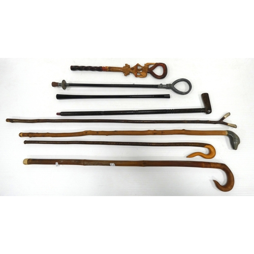 89 - Group of walking sticks to include an example with a dog head, and shooting stick.
