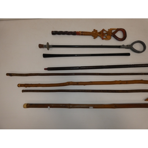 89 - Group of walking sticks to include an example with a dog head, and shooting stick.