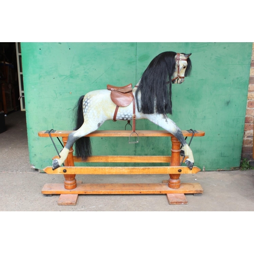 455 - 19th century rocking horse with horse hair mane and tail, leather tack, raised on crossoform cradle,... 
