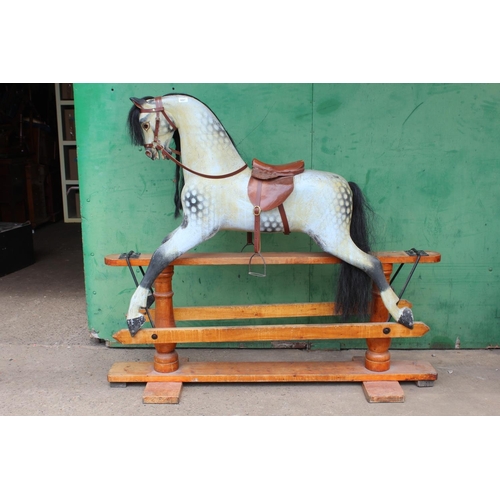 455 - 19th century rocking horse with horse hair mane and tail, leather tack, raised on crossoform cradle,... 