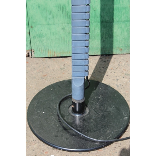490 - Late 20th century standard lamp with black circular metal shade and flexible stem, circular plinth b... 