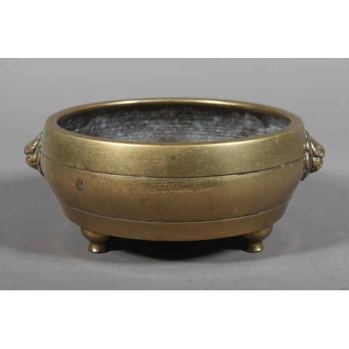438 - Chinese bronze censer of shallow bowl form with fu dog handles, six character mark to the side and d... 